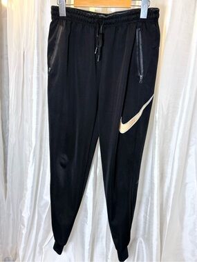 Nike Black Joggers with Gold Swoosh Accent